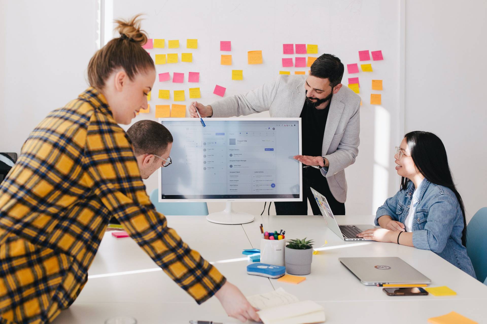 Colleagues researching and discussing the difference between technical SEO and SEO